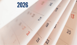 A side view of four pages of a calendar being flipped with 2026 in text added to top