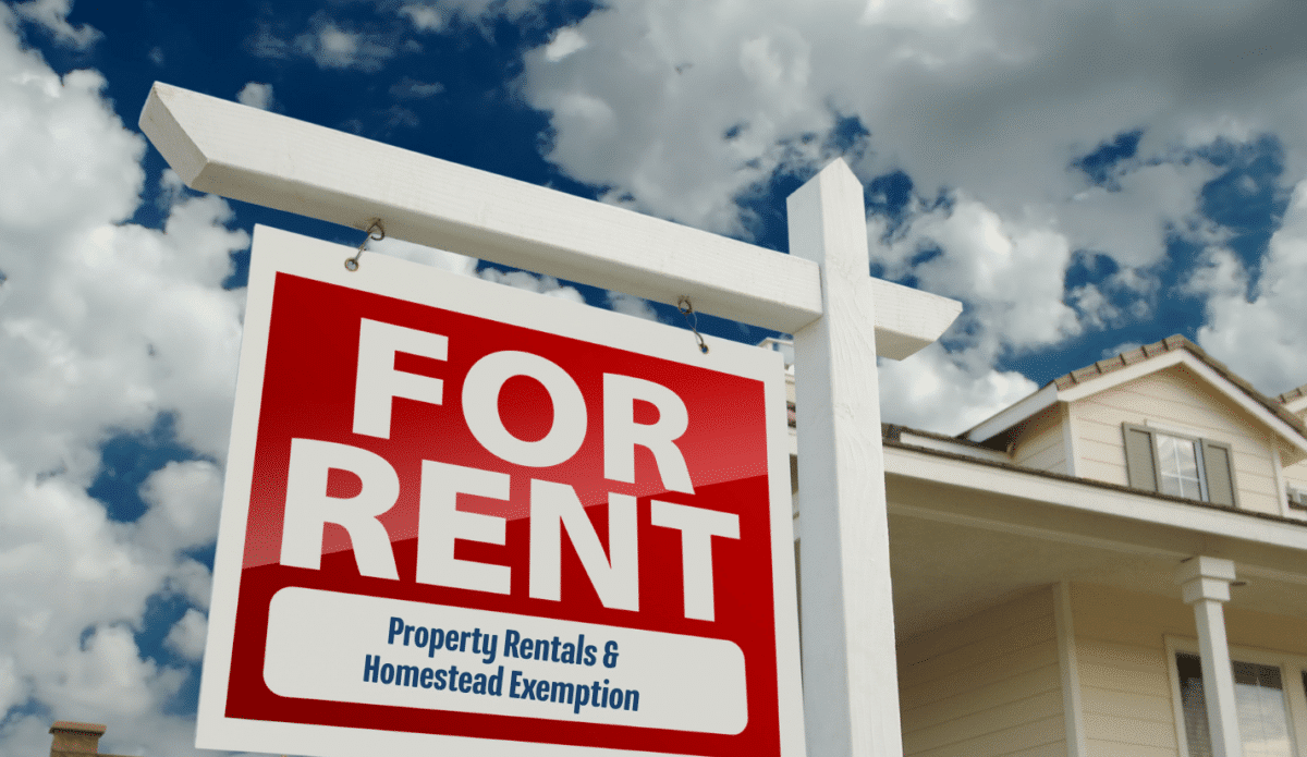 For rent sign near residential building with words under for rent on sign - property rentals and homestead exemption