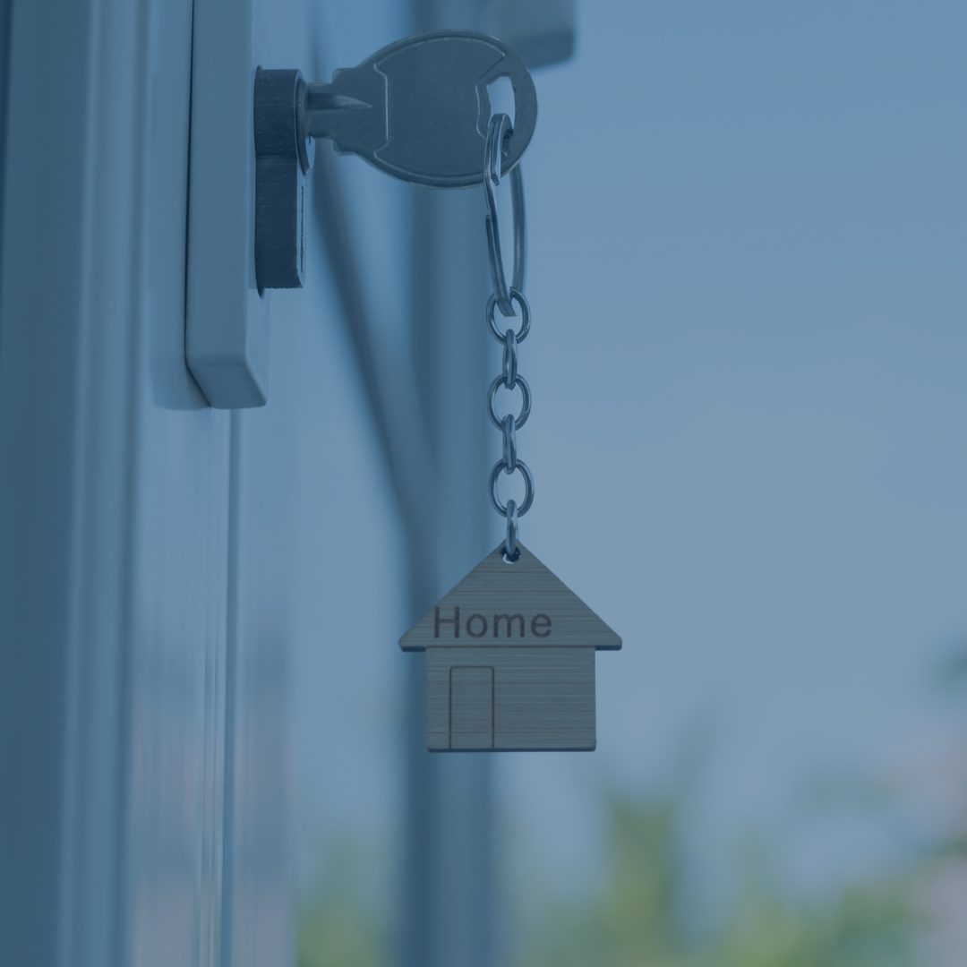 New home image depicting key in door with small house on keychain