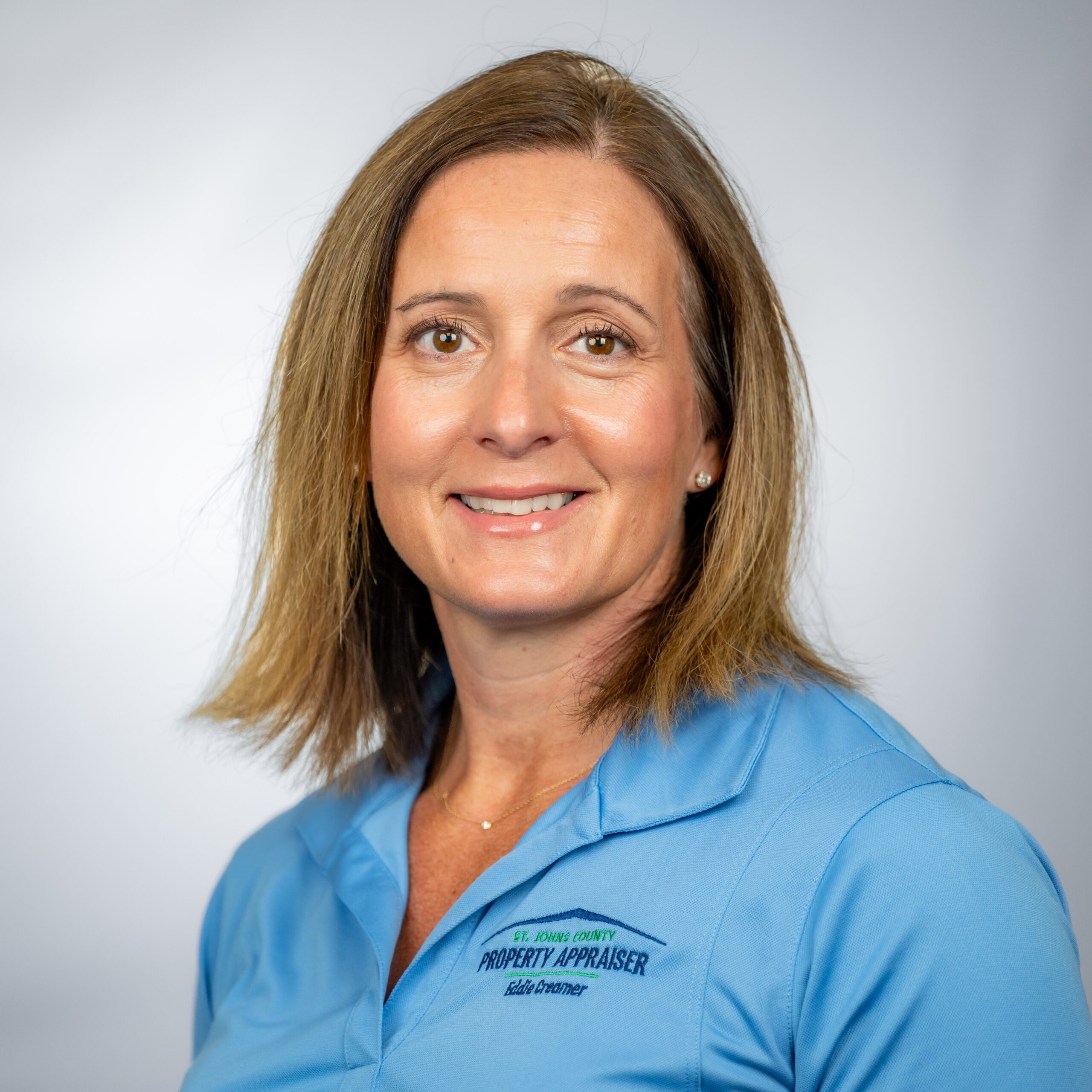 Photo of Charity with blue shirt and gray background