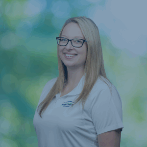 Professional photo of Megan with white shirt and green background