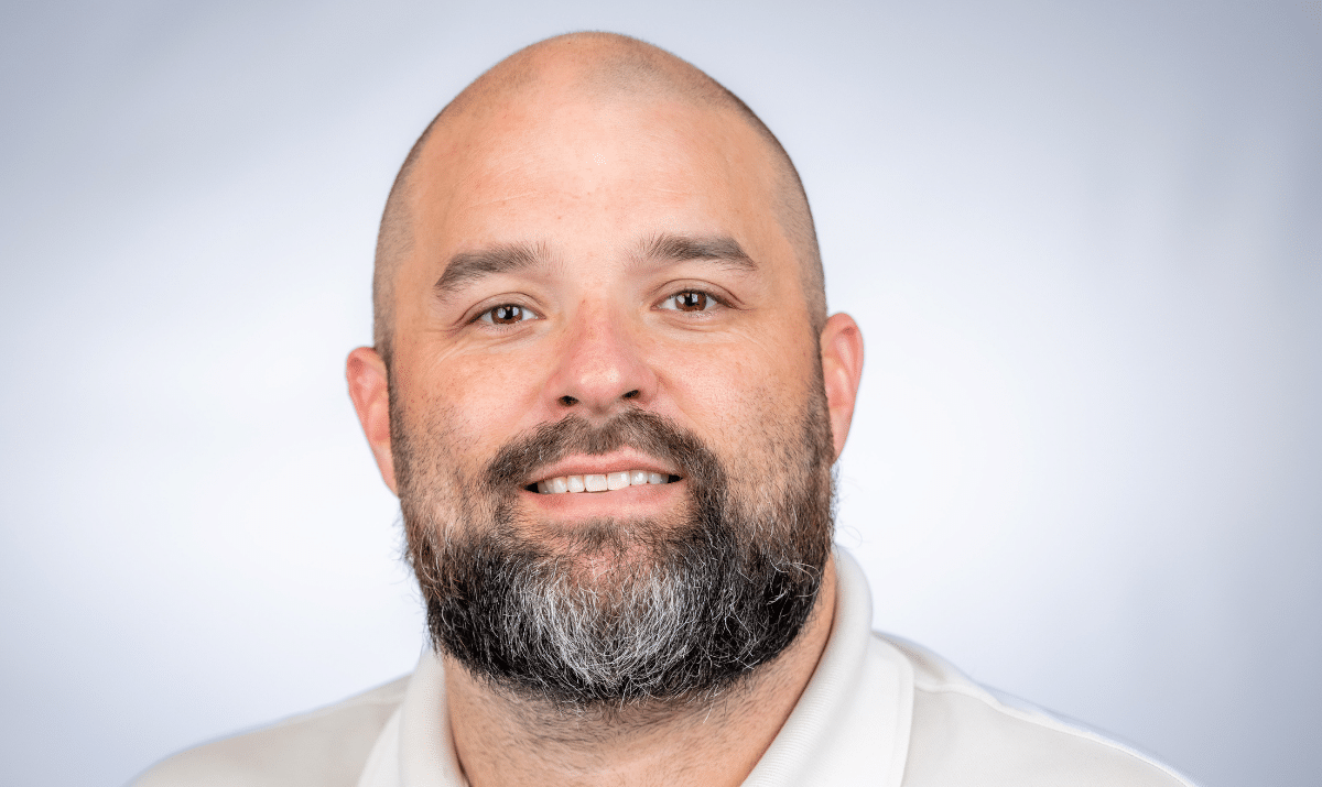 Brett with white shirt and gray background